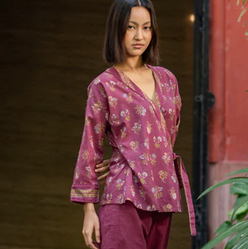 pretty wrap top in plum with a crossover design, worn over deep plum pants