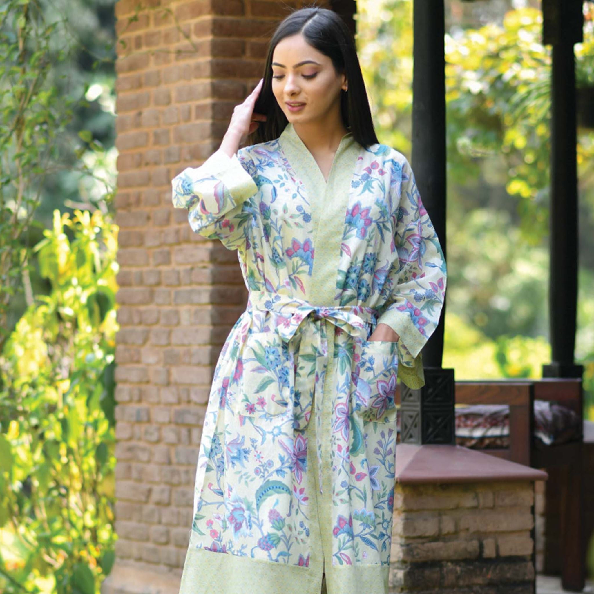 One Size, Soft Cotton Kimono for Loungewear or Travel, handprinted in India. Kerala Butter. Light background with pale yellow green border and purple blue floral motifs.