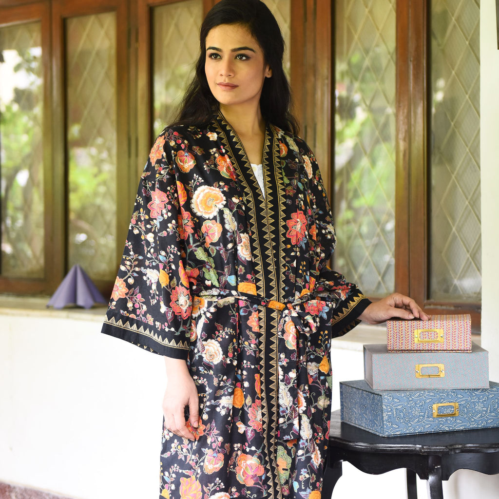 One Size, Soft Cotton Kimono for Loungewear or Travel, handprinted in India. Malabar Black. Black background with orange, and golden yellow floral motifs