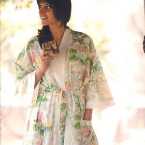 One Size, Soft Cotton Kimono for Loungewear or Travel, handprinted in India. Sardinia Country. Light background with Italian inspired floral motifs in pink, yellow and green.