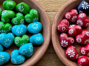 Collection of Colourful tiny rainbow colored soapstone hearts with white etched flowers, green, turquoise and red.
