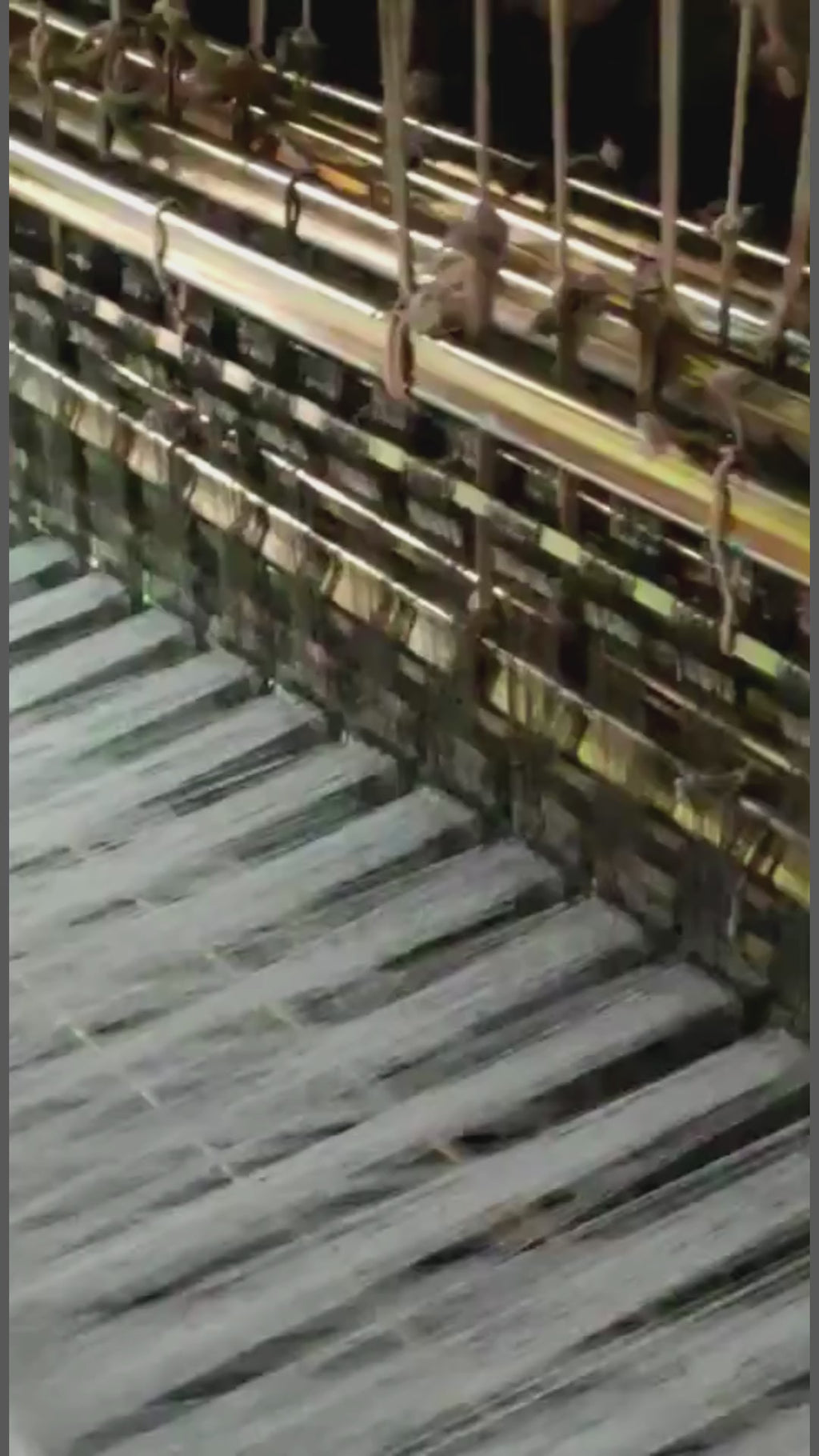 Sujani, hand woven on a double loom in Gujerat, India. Working on the loom, detail.