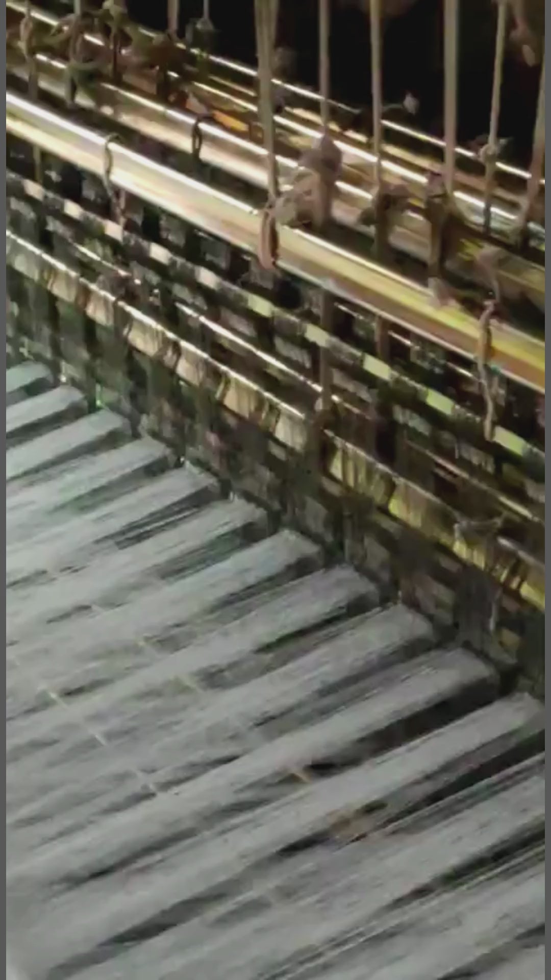 Sujani, hand woven on a double loom in Gujerat, India. Working on the loom, detail.