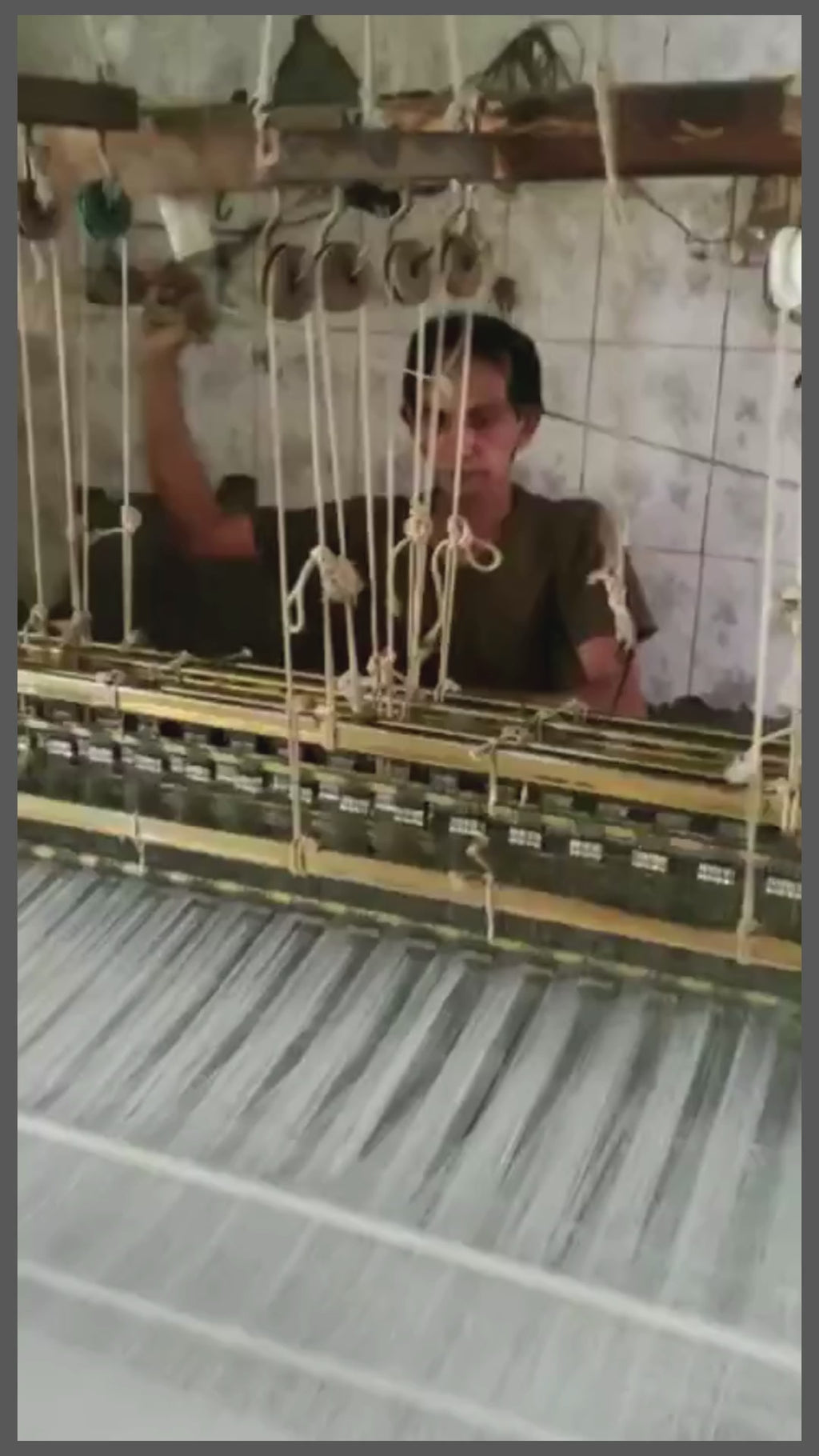Sujani, hand woven on a double loom in Gujerat, India. Working on the loom.